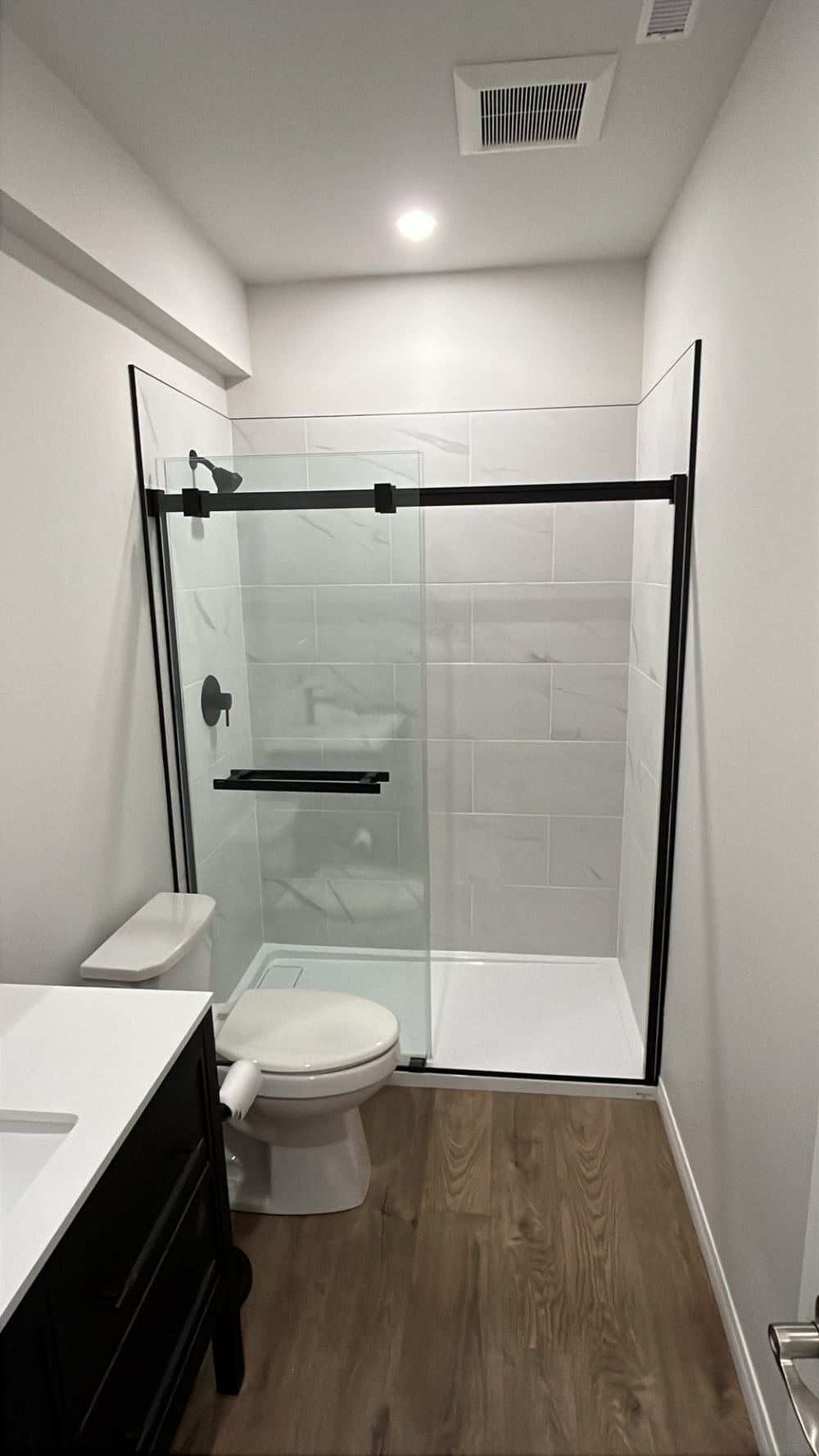 A freshly renovated home interior with new flooring and finishes by Renew YYC
